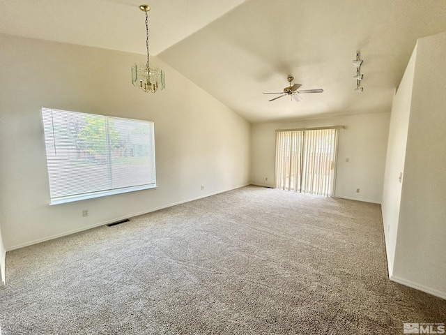 1449 N Marion Russell Dr, Gardnerville, NV 89410 - empty room featuring carpet, ceiling fan, lofted ceiling, a chandelier, and baseboards