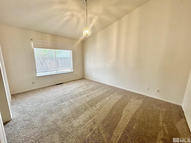 1449 N Marion Russell Dr, Gardnerville, NV 89410 - empty room with carpet floors, lofted ceiling, baseboards, and a chandelier