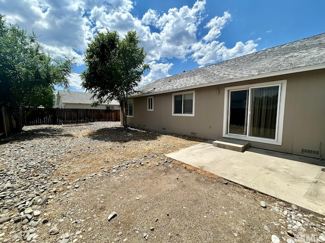 1449 N Marion Russell Dr, Gardnerville, NV 89410 - back of property with a fenced backyard, crawl space, and a patio area