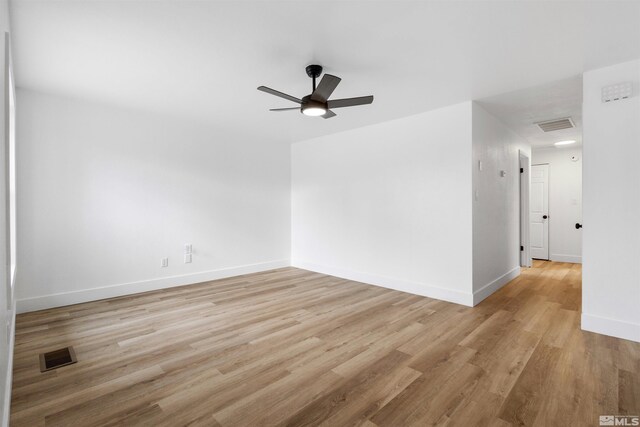 6798 Flower St, Reno, NV 89506 - unfurnished room with a ceiling fan, light wood-style floors, and baseboards