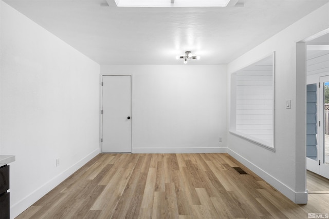 6798 Flower St, Reno, NV 89506 - unfurnished dining area with light wood-style flooring and baseboards