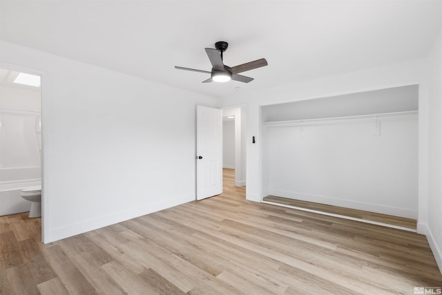 6798 Flower St, Reno, NV 89506 - unfurnished bedroom with wood finished floors, a closet, baseboards, ensuite bath, and ceiling fan