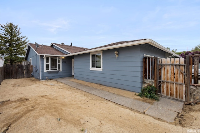 6798 Flower St, Reno, NV 89506 - view of front of property featuring fence and a gate