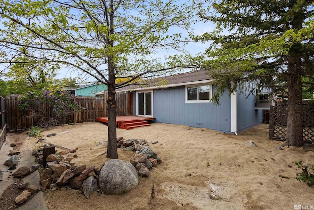 6798 Flower St, Reno, NV 89506 - rear view of house with fence and a deck