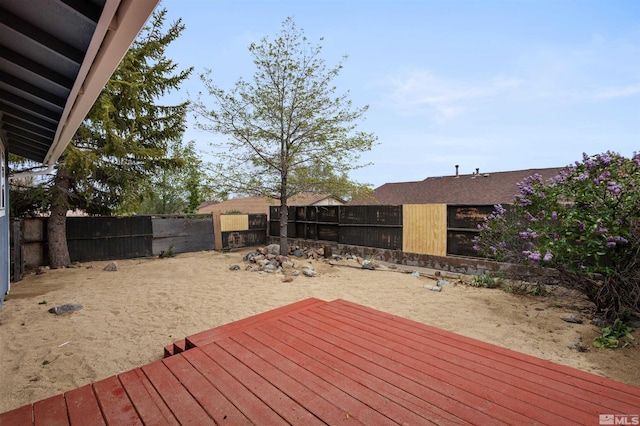 6798 Flower St, Reno, NV 89506 - wooden terrace featuring a fenced backyard