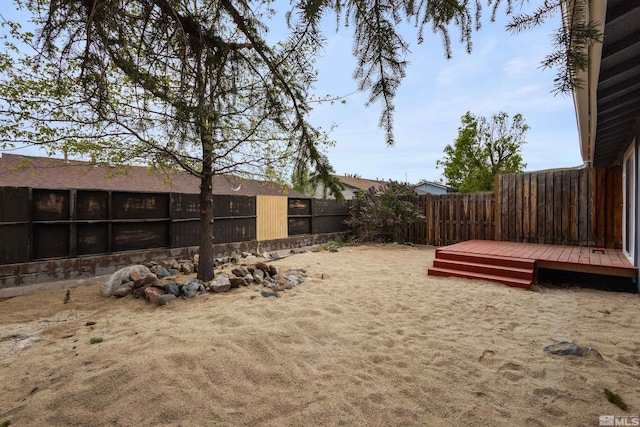6798 Flower St, Reno, NV 89506 - fenced backyard featuring a wooden deck