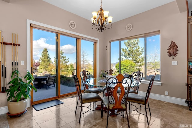 10401 Copper Cloud Dr, Reno, NV 89511 - dining room with a chandelier, healthy amount of natural light, and baseboards