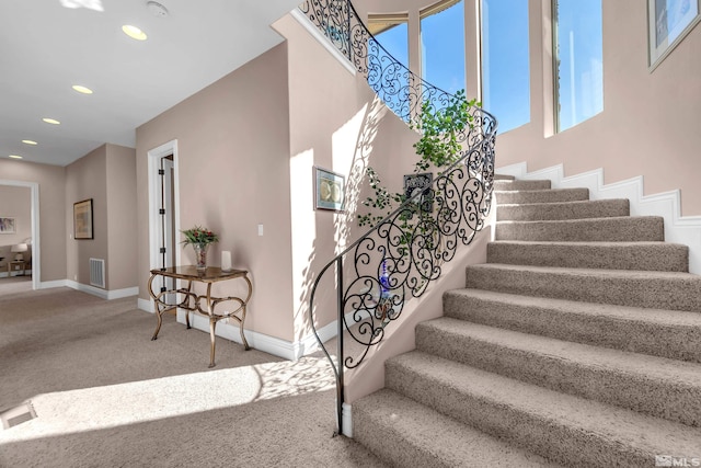 10401 Copper Cloud Dr, Reno, NV 89511 - stairs featuring carpet flooring, baseboards, and recessed lighting