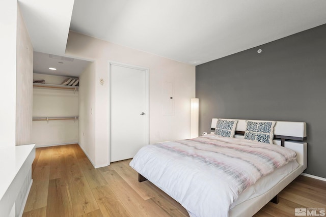 bedroom with light wood-style flooring