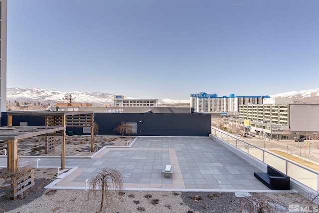 view of patio / terrace with a mountain view