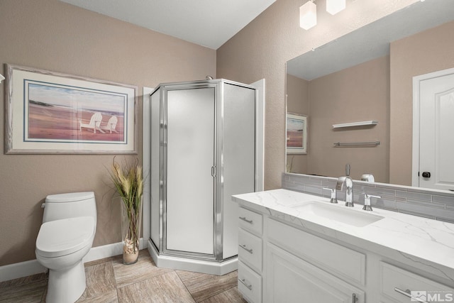 2963 Moose Ridge Dr, Reno, NV 89523 - bathroom with a stall shower, vanity, toilet, baseboards, and a textured wall
