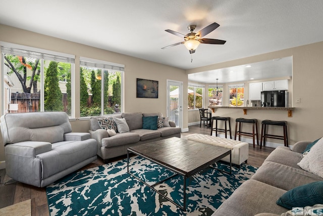 2963 Moose Ridge Dr, Reno, NV 89523 - living room with healthy amount of natural light, wood finished floors, ceiling fan, and baseboards