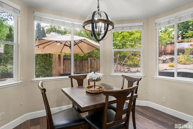 2963 Moose Ridge Dr, Reno, NV 89523 - dining area with dark wood finished floors, a chandelier, and baseboards