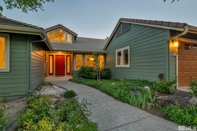14250 Quiet Meadows Dr, Reno, NV 89511 - view of front of home featuring a garage and a tile roof