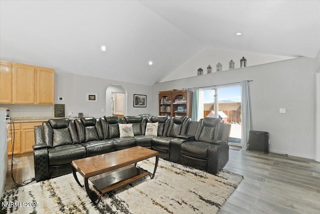391A Bens Way, Fernley, NV 89408 - living room with arched walkways, light wood-style flooring, high vaulted ceiling, and recessed lighting