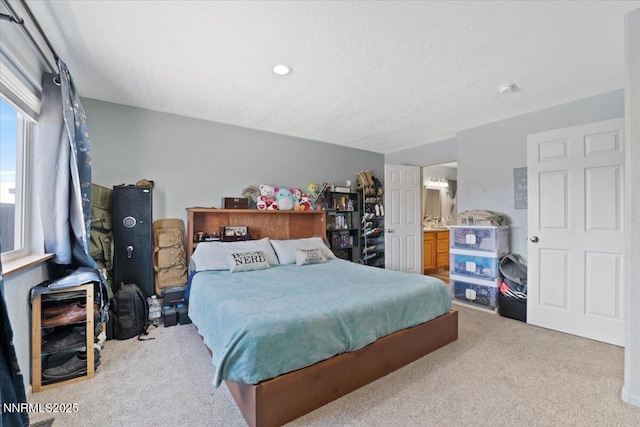 391A Bens Way, Fernley, NV 89408 - carpeted bedroom with ensuite bathroom and a textured ceiling