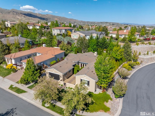 aerial perspective of suburban area featuring a mountainous background