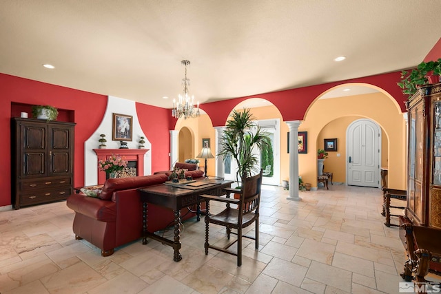 dining space featuring arched walkways, stone tile floors, recessed lighting, and ornate columns
