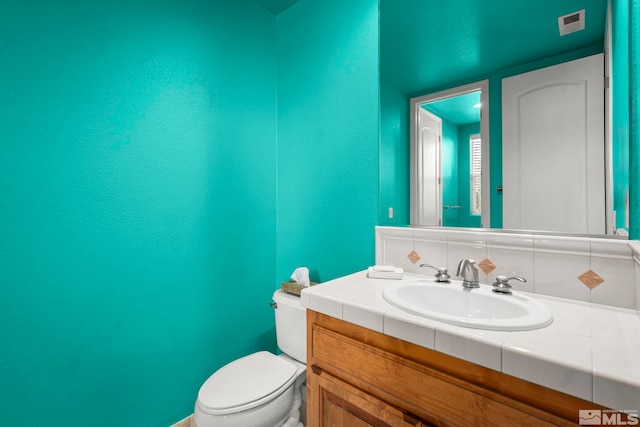 half bath with toilet and vanity