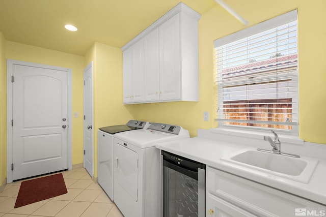 washroom with beverage cooler, washer and clothes dryer, light tile patterned flooring, and recessed lighting