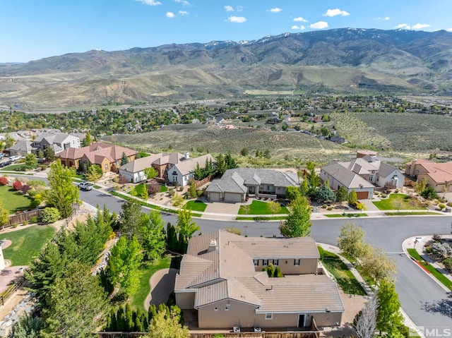 aerial view of residential area with a mountainous background