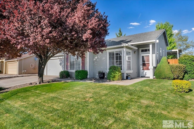 7766 Cerritos Cir, Sparks, NV 89436 - view of front facade with a front lawn, driveway, a garage, and a shingled roof