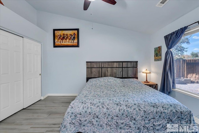 7766 Cerritos Cir, Sparks, NV 89436 - bedroom featuring baseboards, wood finished floors, a ceiling fan, a closet, and lofted ceiling