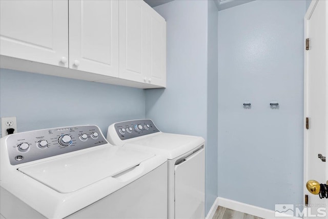 7766 Cerritos Cir, Sparks, NV 89436 - clothes washing area with washer and clothes dryer and cabinet space