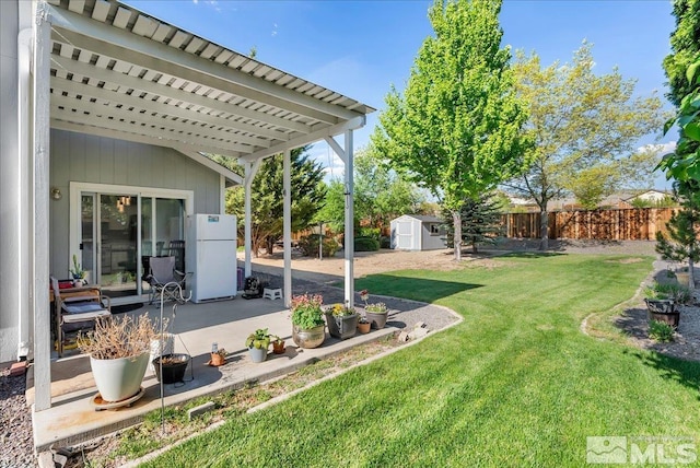 7766 Cerritos Cir, Sparks, NV 89436 - view of yard featuring a storage shed, a patio area, and an outdoor structure