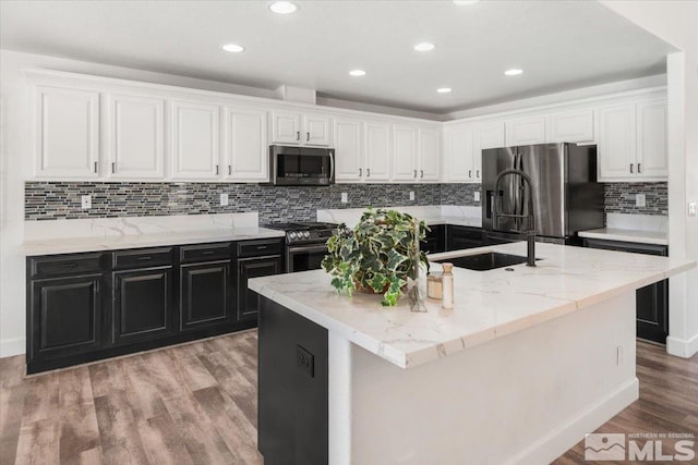 2160 Mammatus Dr, Sparks, NV 89441 - kitchen with stainless steel appliances, a sink, white cabinetry, and recessed lighting