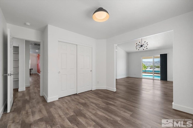 2160 Mammatus Dr, Sparks, NV 89441 - unfurnished bedroom with wood finished floors, baseboards, and a closet