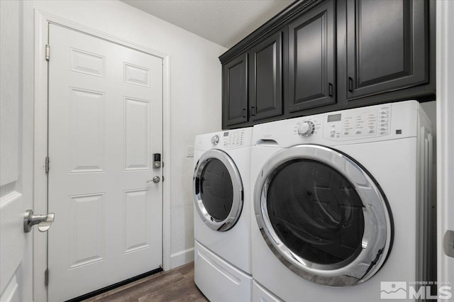 2160 Mammatus Dr, Sparks, NV 89441 - washroom with cabinet space, washing machine and dryer, dark wood-style flooring, and baseboards