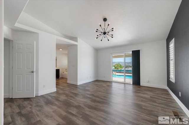 2160 Mammatus Dr, Sparks, NV 89441 - spare room featuring a chandelier, wood finished floors, baseboards, and vaulted ceiling