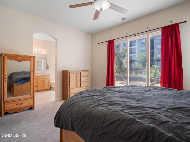 1840 Granite Chief Dr, Reno, NV 89521 - carpeted bedroom featuring access to outside, ensuite bathroom, arched walkways, and a ceiling fan