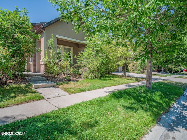 1840 Granite Chief Dr, Reno, NV 89521 - view of property hidden behind natural elements featuring stucco siding and a front yard