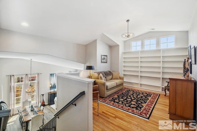 4822 Ramcreek Trl, Reno, NV 89519 - living area with a chandelier, lofted ceiling, and wood finished floors