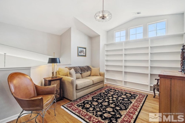4822 Ramcreek Trl, Reno, NV 89519 - living room featuring wood finished floors, lofted ceiling, and a chandelier