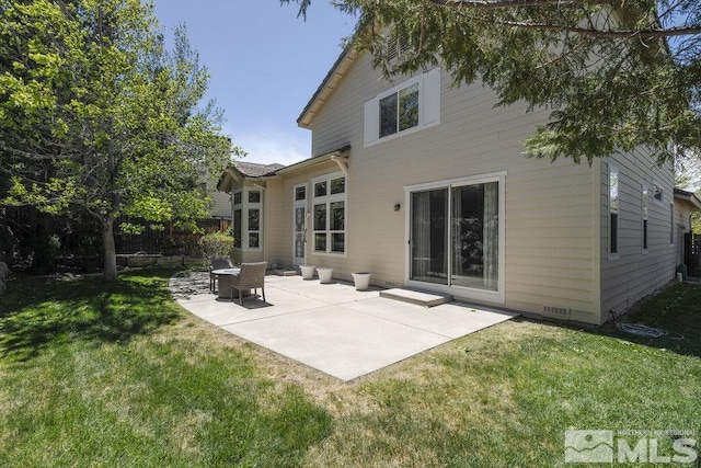 4822 Ramcreek Trl, Reno, NV 89519 - rear view of property featuring a lawn and a patio