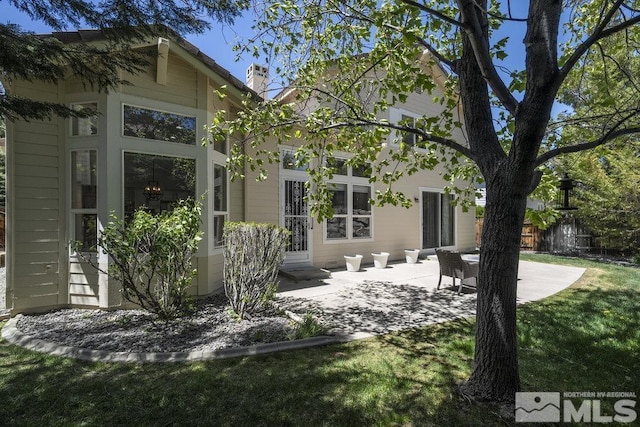 4822 Ramcreek Trl, Reno, NV 89519 - rear view of property featuring a patio and a lawn