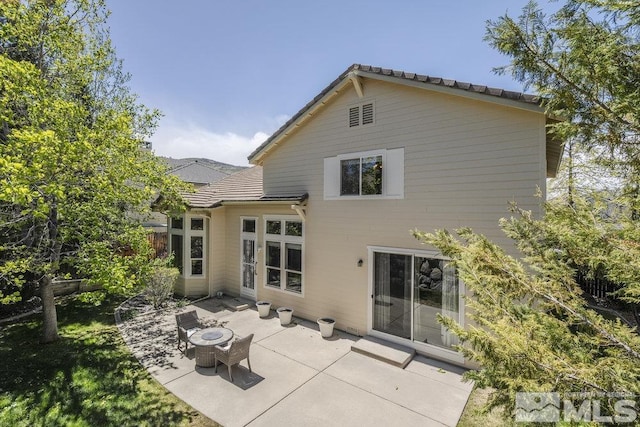 4822 Ramcreek Trl, Reno, NV 89519 - rear view of house featuring a patio