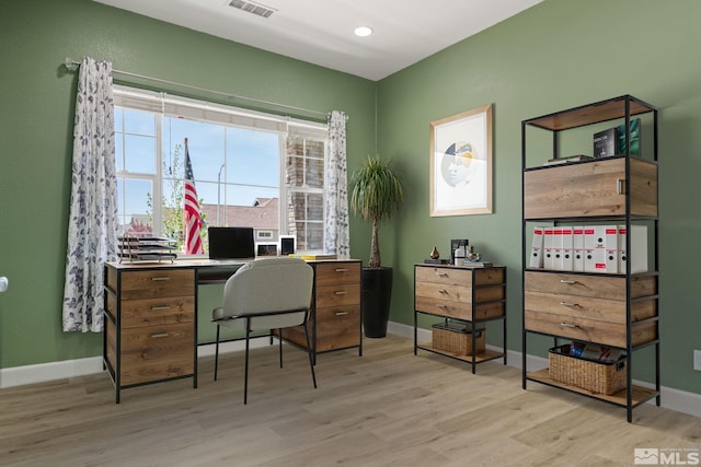 office with light wood finished floors and baseboards