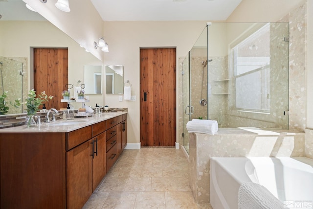 full bath with a garden tub, a stall shower, and double vanity