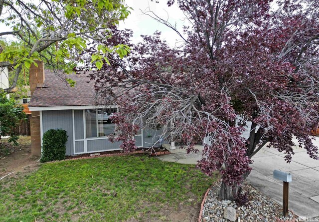 1476 Heather Ct, Sparks, NV 89434 - back of property featuring a lawn and a shingled roof