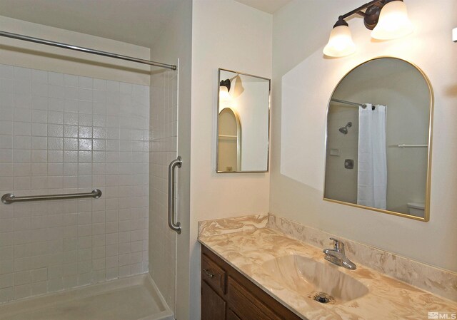 1476 Heather Ct, Sparks, NV 89434 - bathroom featuring tiled shower and vanity