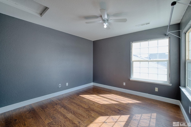 250 Corral Dr, Dayton, NV 89403 - spare room featuring wood finished floors, ceiling fan, baseboards, and a textured wall
