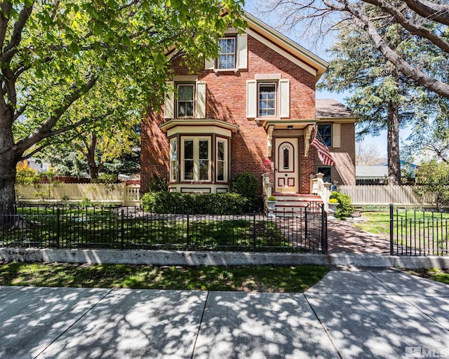 308 Thompson, Carson City, NV 89703 - view of front of property with brick siding and a fenced front yard