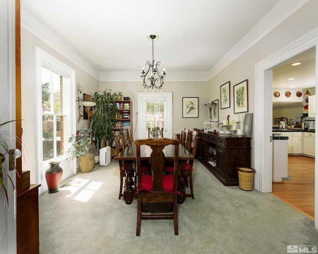 308 Thompson, Carson City, NV 89703 - dining area with healthy amount of natural light, a chandelier, and light carpet