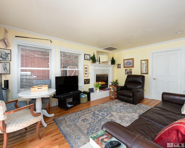 308 Thompson, Carson City, NV 89703 - living room featuring ornamental molding, a fireplace, and wood finished floors
