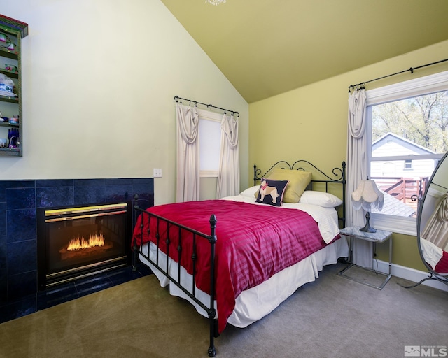 308 Thompson, Carson City, NV 89703 - bedroom featuring lofted ceiling, a fireplace, carpet floors, and baseboards