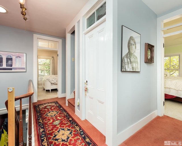 308 Thompson, Carson City, NV 89703 - hall featuring light carpet and healthy amount of natural light